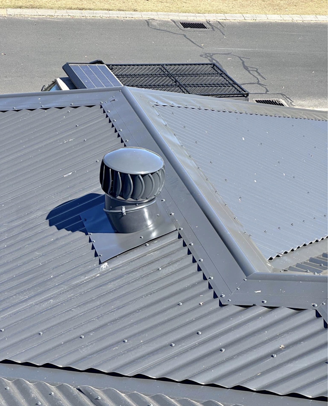 New Colorbond roof with whirlybird ventilation installed